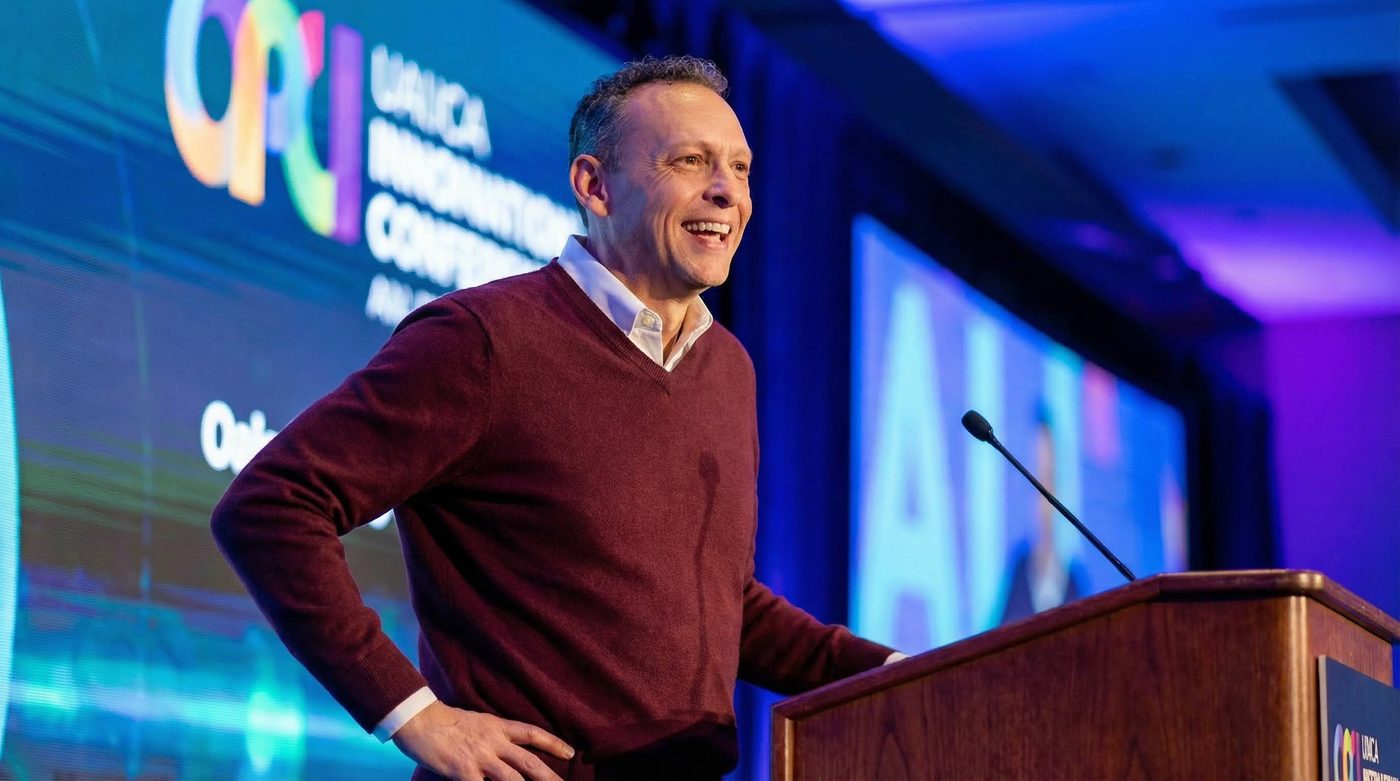 Patrick D. Lynch keynote speaking at a conference podium